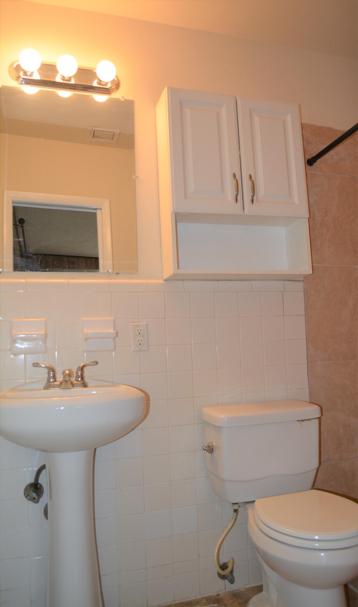 28520 Southwest 146th Avenue Homestead, FL 33033 - Photo 7 of 23 a bathroom with a sink a mirror and toilet