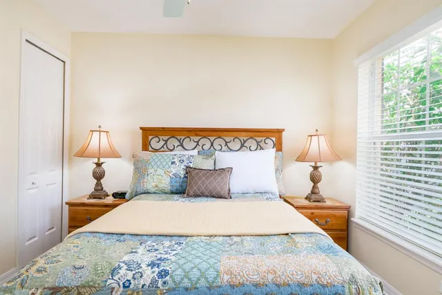 a bedroom with a bed and window