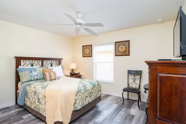 a bedroom with a bed and a table in it