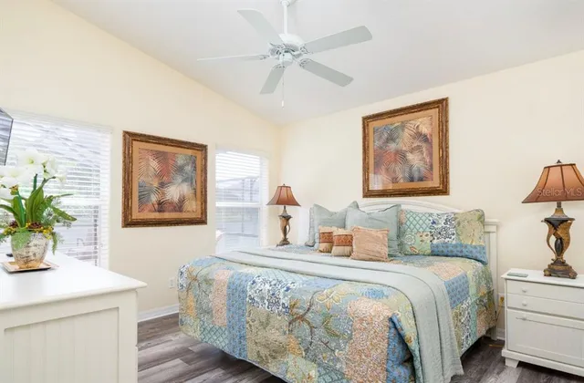 a bedroom with a bed and a potted plant