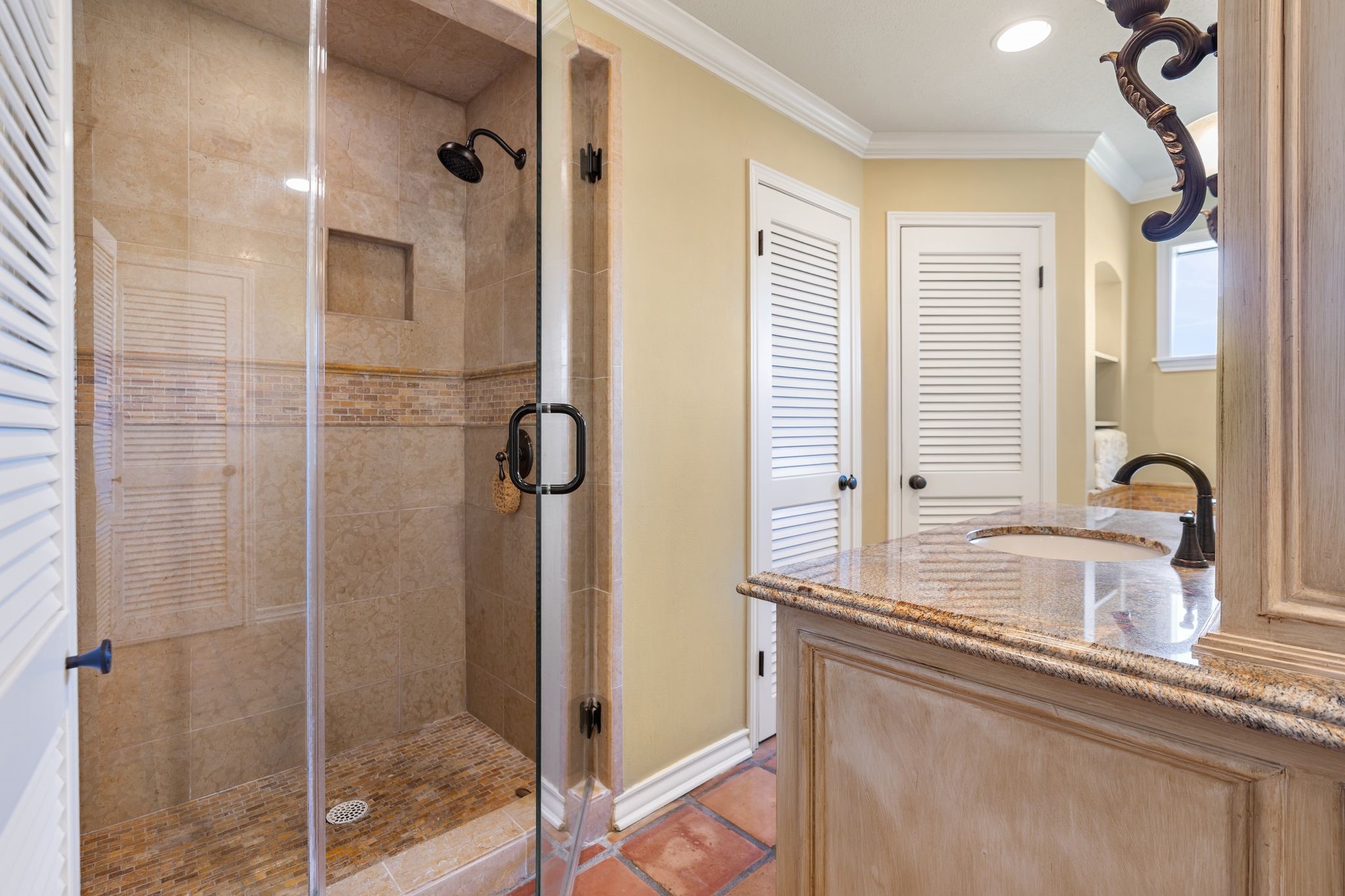 905 Sunny Lane Wharton, TX 77488 - Photo 28 of 50 a bathroom with a shower sink and mirror