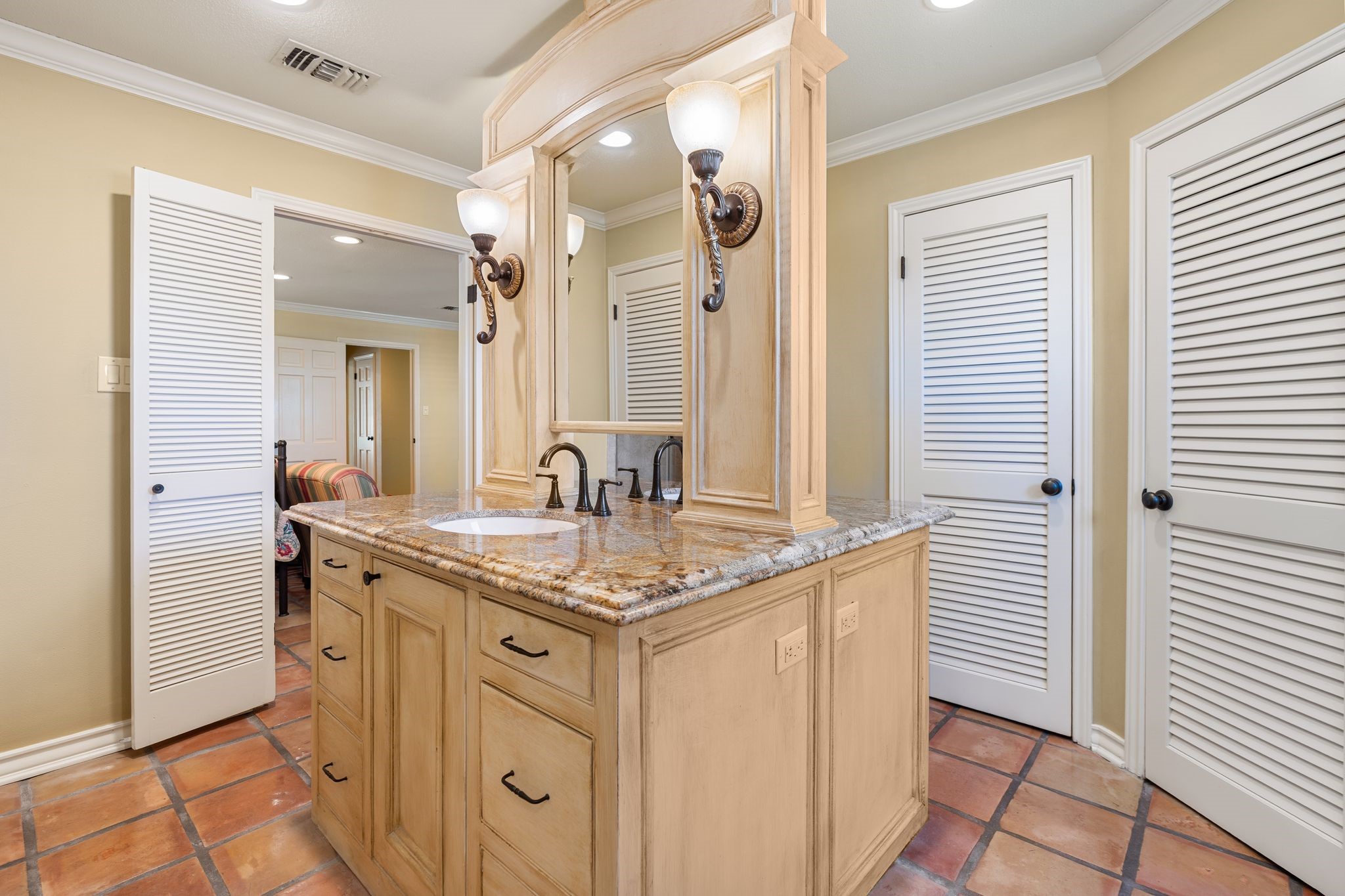 905 Sunny Lane Wharton, TX 77488 - Photo 29 of 50 a bathroom with a granite countertop sink and a mirror