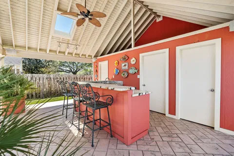 a living room with furniture fireplace and a large window