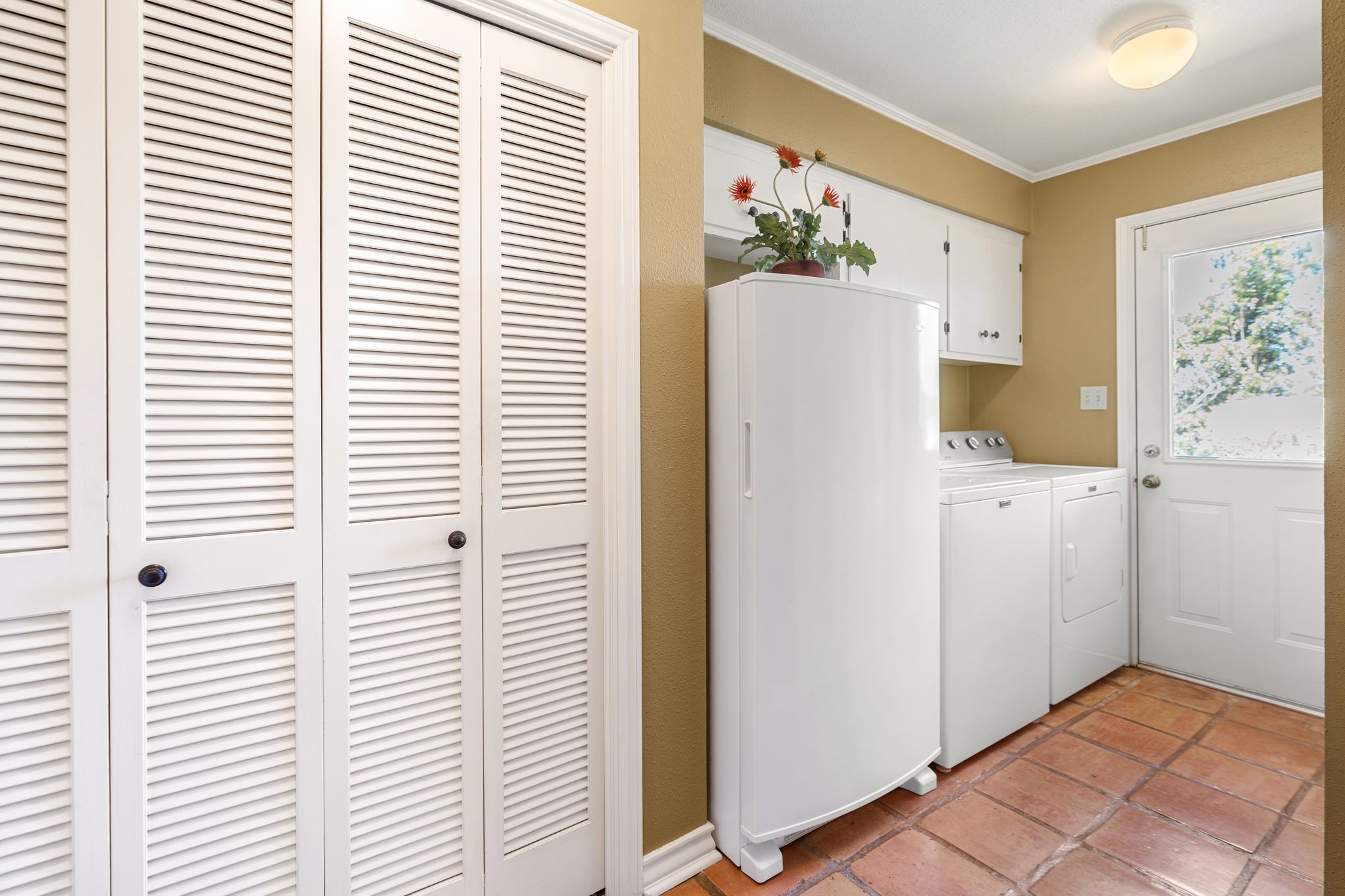 905 Sunny Lane Wharton, TX 77488 - Photo 40 of 50 The laundry room offers built-in storage and functionality, making everyday tasks simple and well organized.