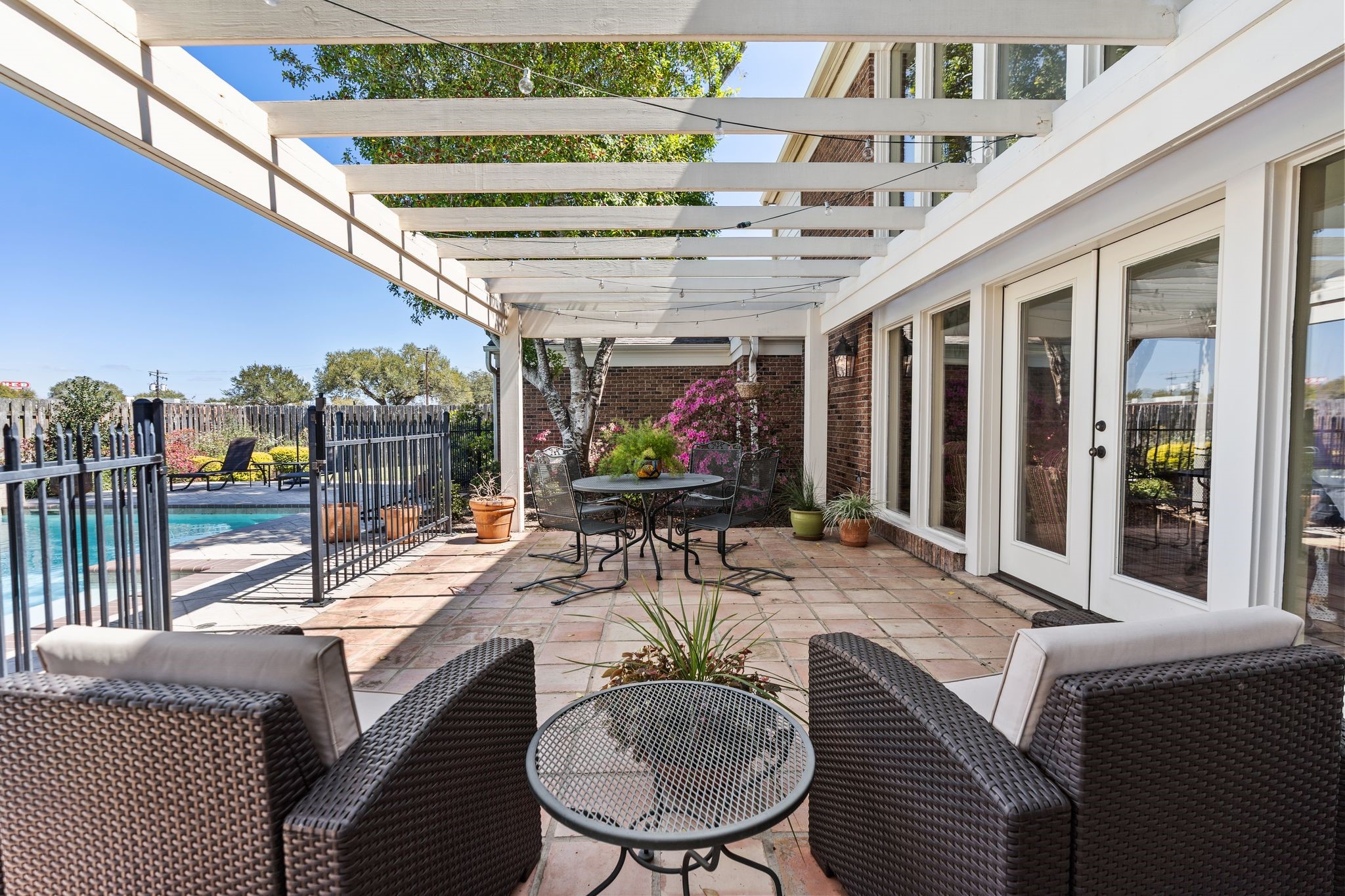 905 Sunny Lane Wharton, TX 77488 - Photo 42 of 50 Designed for effortless outdoor living, this expansive patio seamlessly extends your living space with room for lounging and dining.