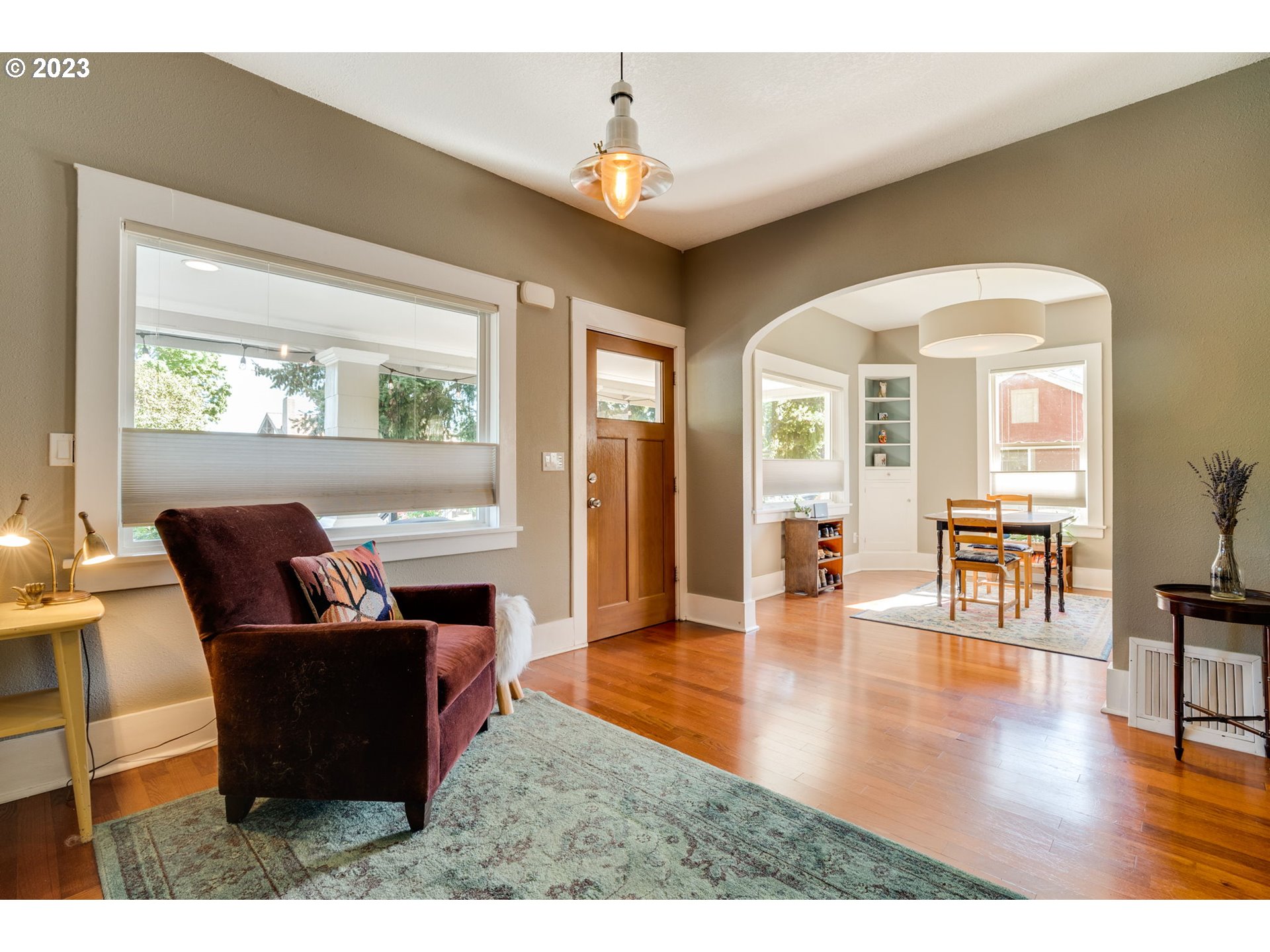 4504 Northeast Alberta Court Portland, OR 97218 - Photo 12 of 37 a living room with furniture and a large window