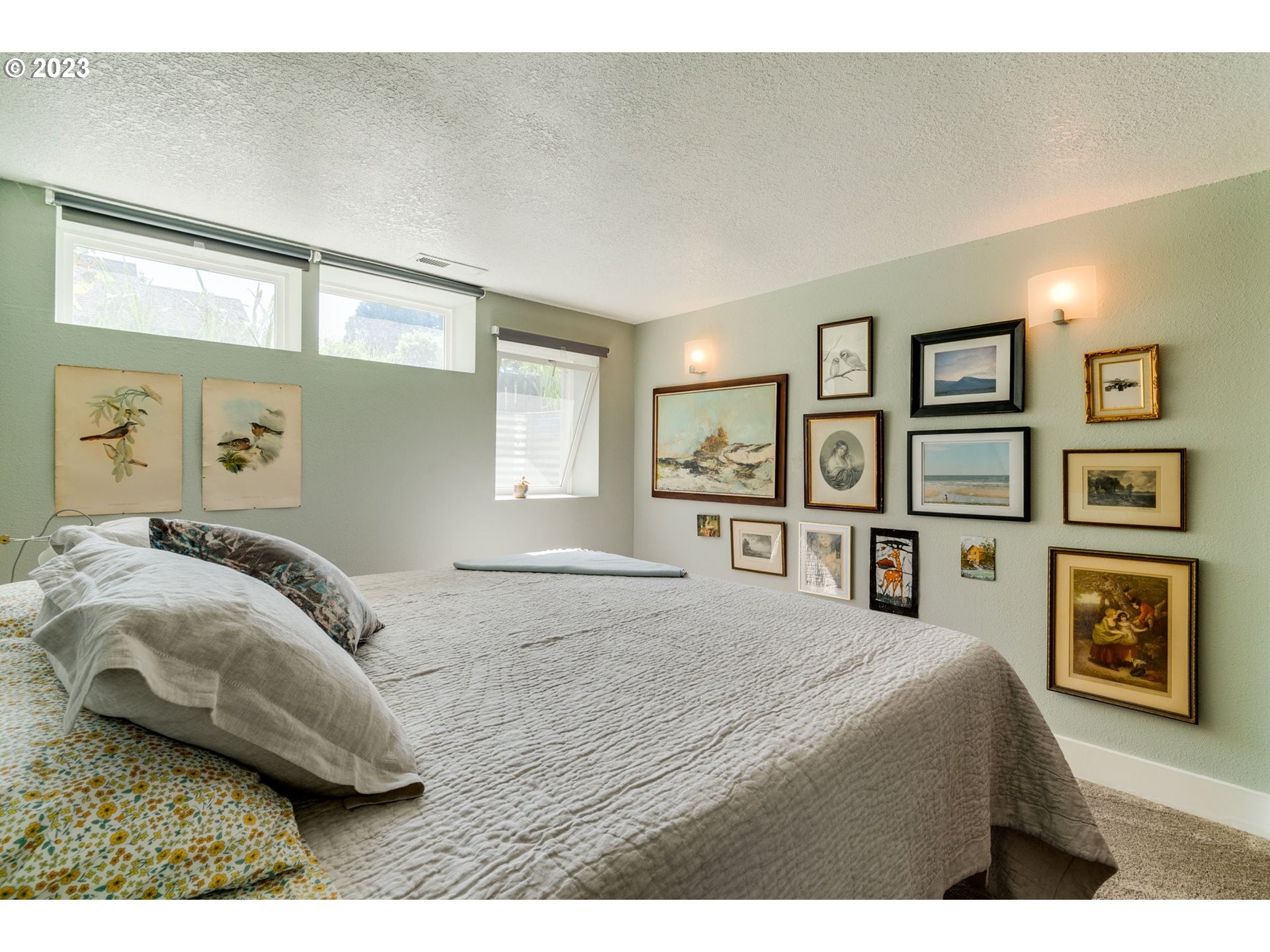 4504 Northeast Alberta Court Portland, OR 97218 - Photo 18 of 37 a bedroom with a bed and wooden floor