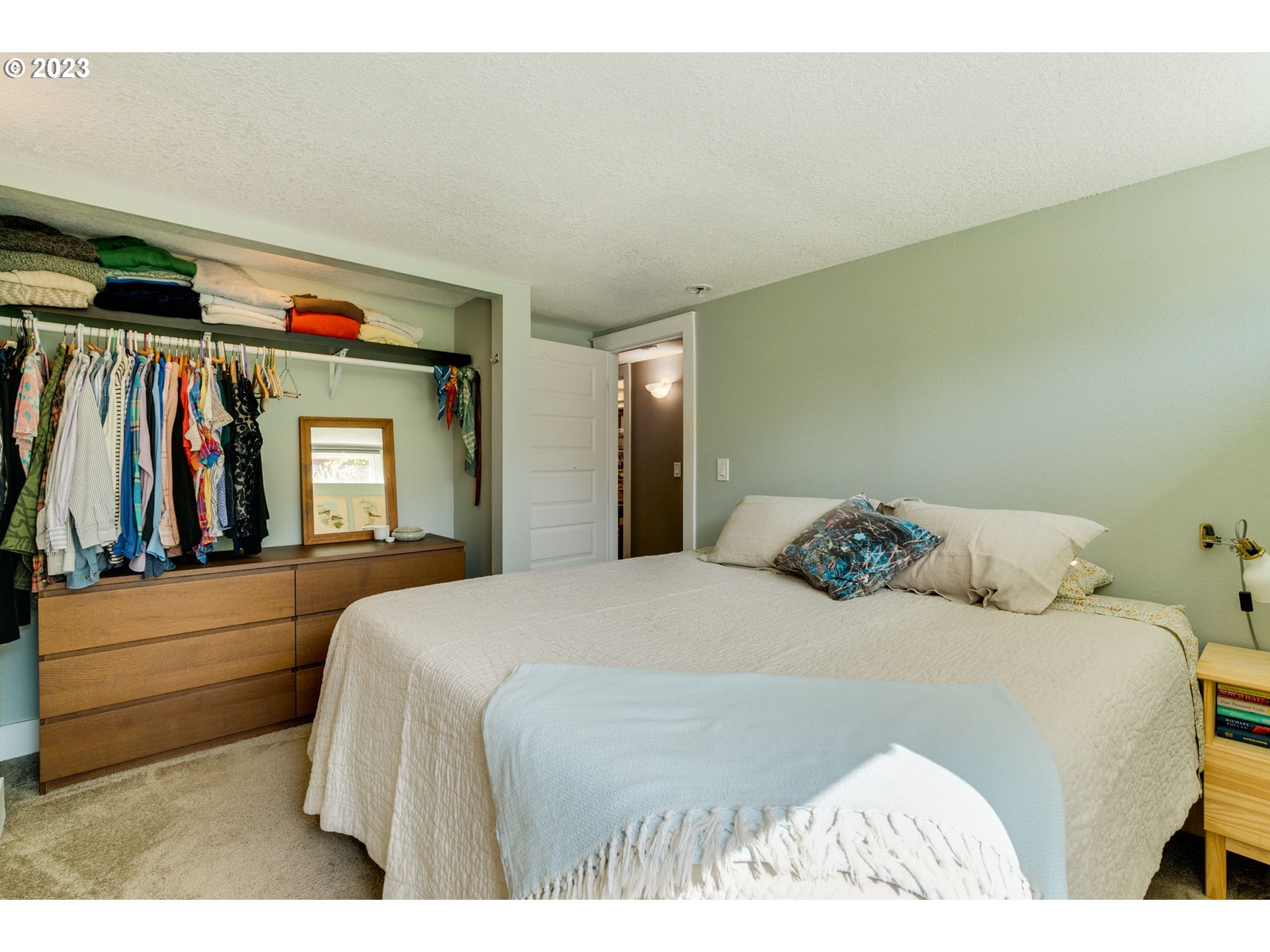 4504 Northeast Alberta Court Portland, OR 97218 - Photo 19 of 37 a bedroom with a bed and a television