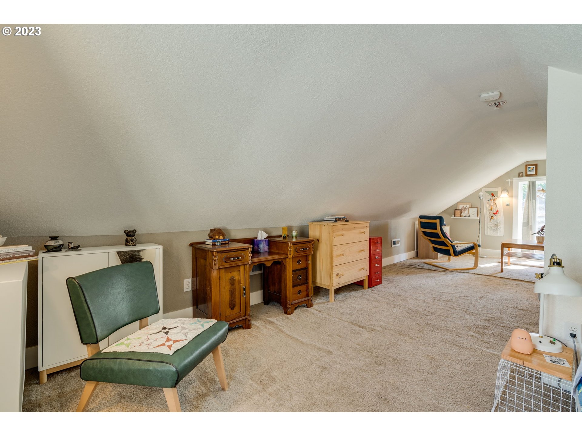 4504 Northeast Alberta Court Portland, OR 97218 - Photo 21 of 37 a living room with furniture and a wooden floor