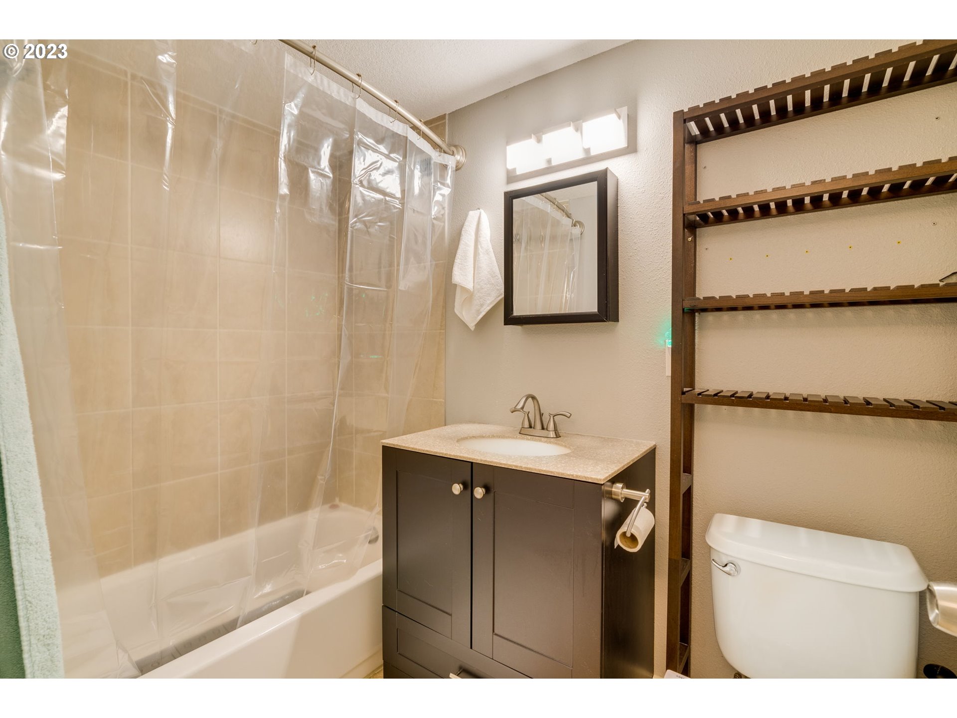 4504 Northeast Alberta Court Portland, OR 97218 - Photo 24 of 37 a bathroom with a sink a toilet and shower
