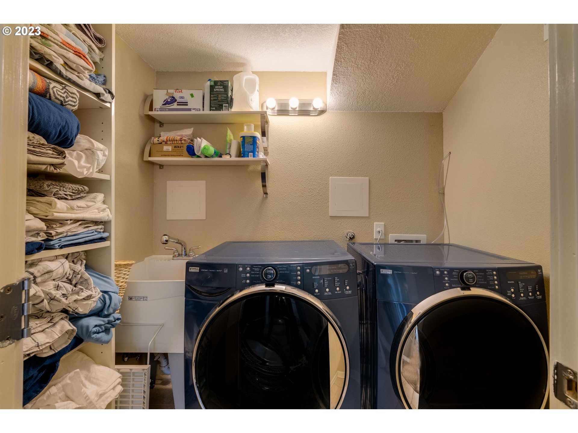 4504 Northeast Alberta Court Portland, OR 97218 - Photo 25 of 37 a utility room with closet dryer and washer