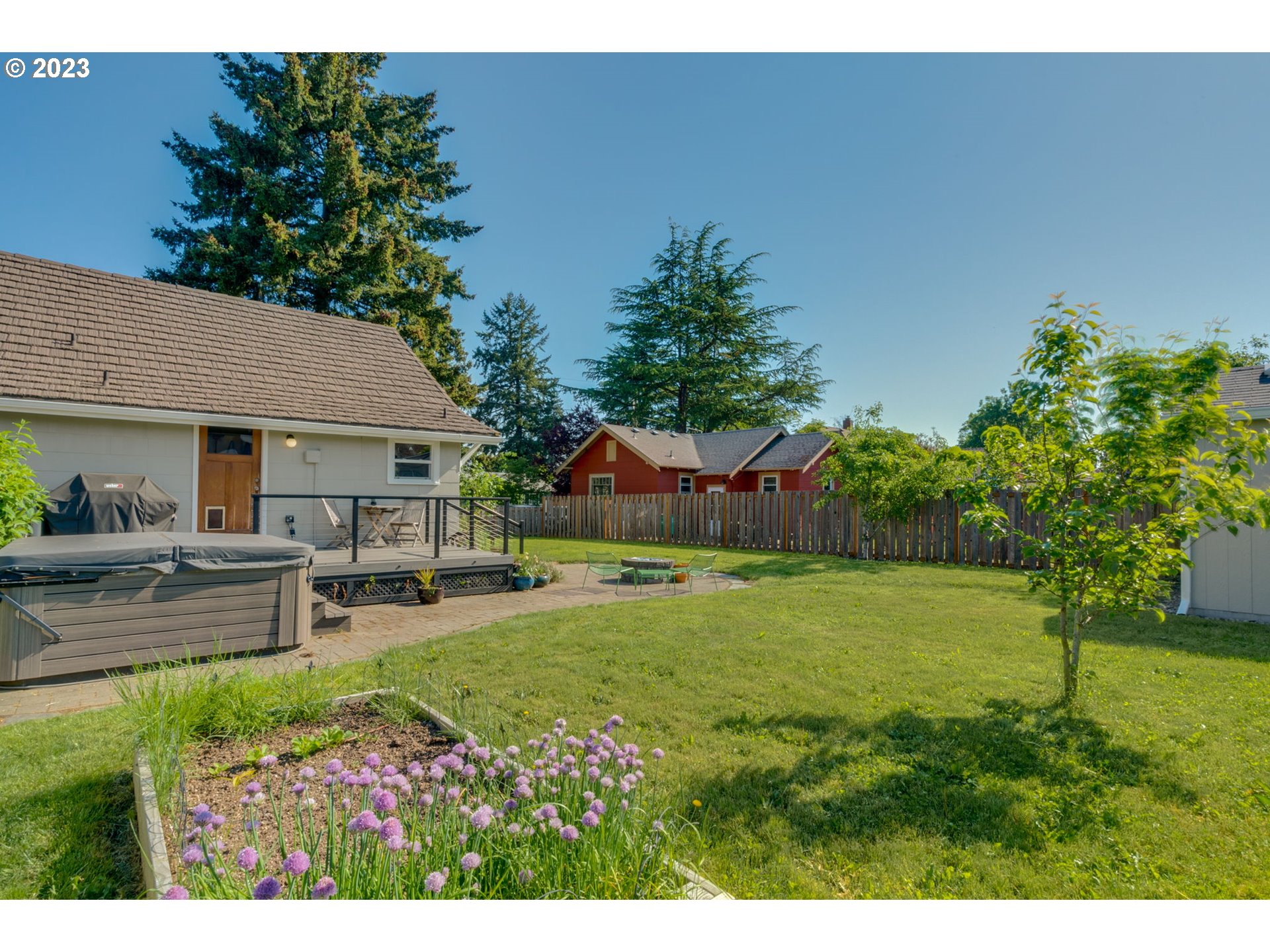 4504 Northeast Alberta Court Portland, OR 97218 - Photo 37 of 37 a view of a house with a yard and sitting area