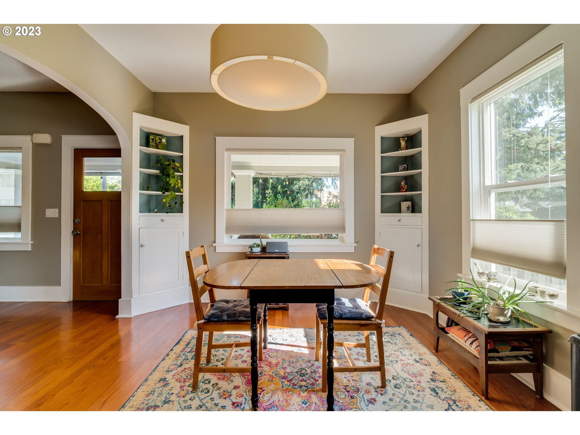 4504 Northeast Alberta Court Portland, OR 97218 - Photo 5 of 37 a view of a dining room with furniture and wooden floor