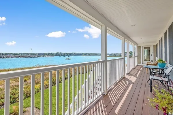 a view of balcony with wooden floor