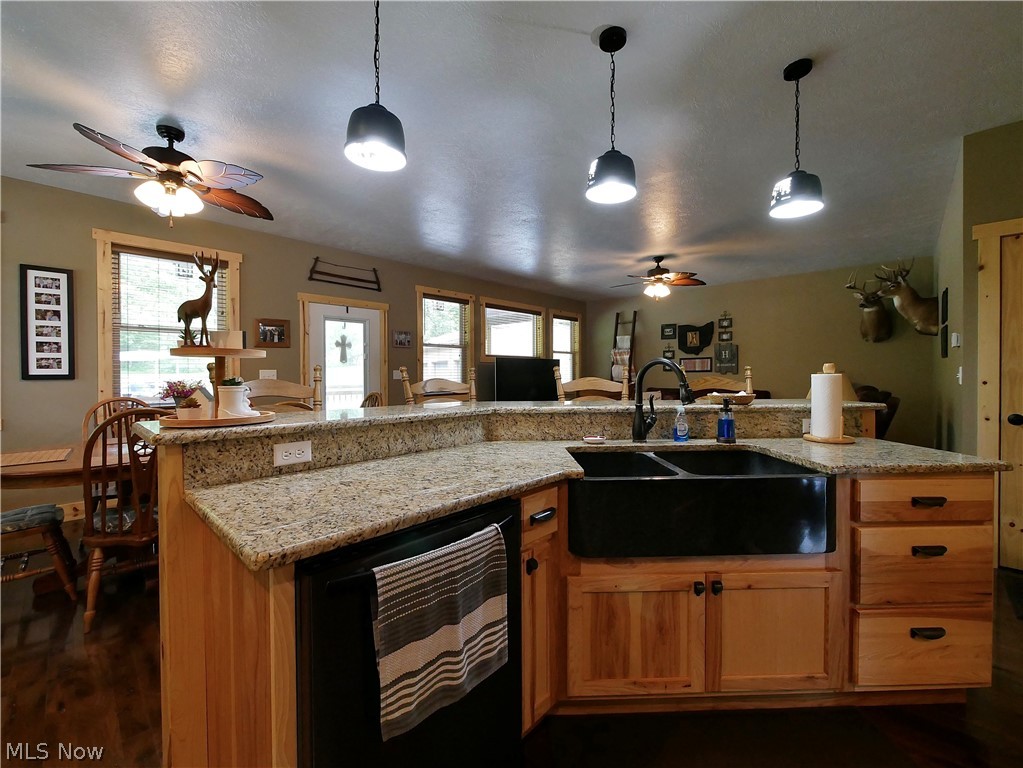 75450 Fair Road Freeport, OH 43973 - Photo 22 of 45 Kitchen featuring hanging light fixtures, sink, dark hardwood / wood-style flooring, and ceiling fan