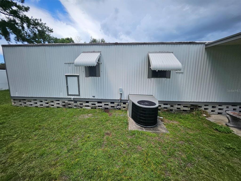 6445 Belle Terre Road New Port Richey, FL 34653 - Photo 3 of 16 a outdoor view of a house