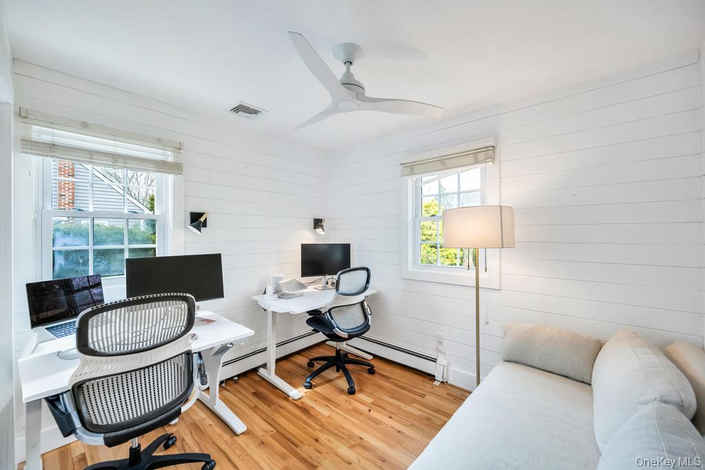 8 Lovell Road Hampton Bays, NY 11946 - Photo 17 of 20 a living room with furniture and a window