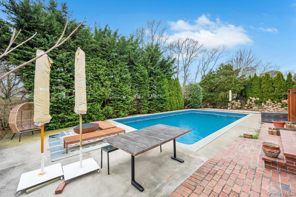 8 Lovell Road Hampton Bays, NY 11946 - Photo 4 of 20 a outdoor view with a sitting space