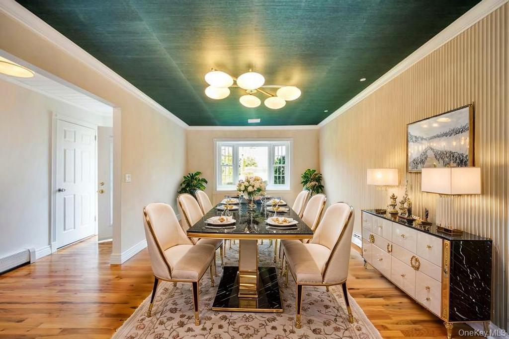 8 Lovell Road Hampton Bays, NY 11946 - Photo 9 of 20 a view of a dining room with furniture and wooden floor