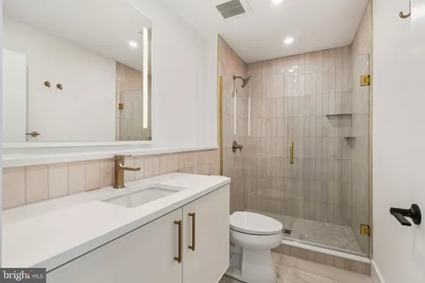 a utility room with cabinets washer and dryer