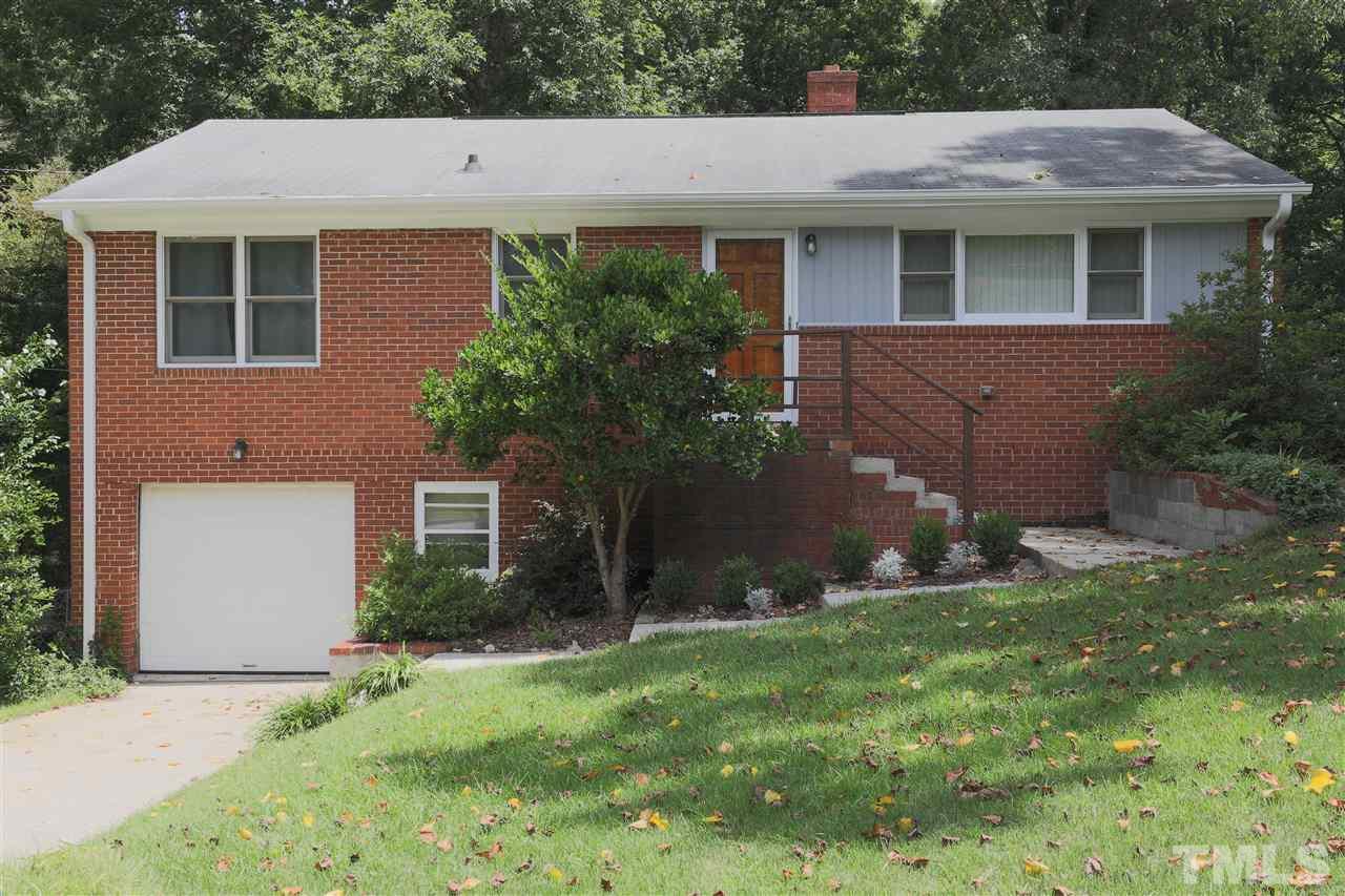 3501 Cranston Road Garner, NC 27529 - Photo 2 of 18 a backyard of a house with plants and large tree