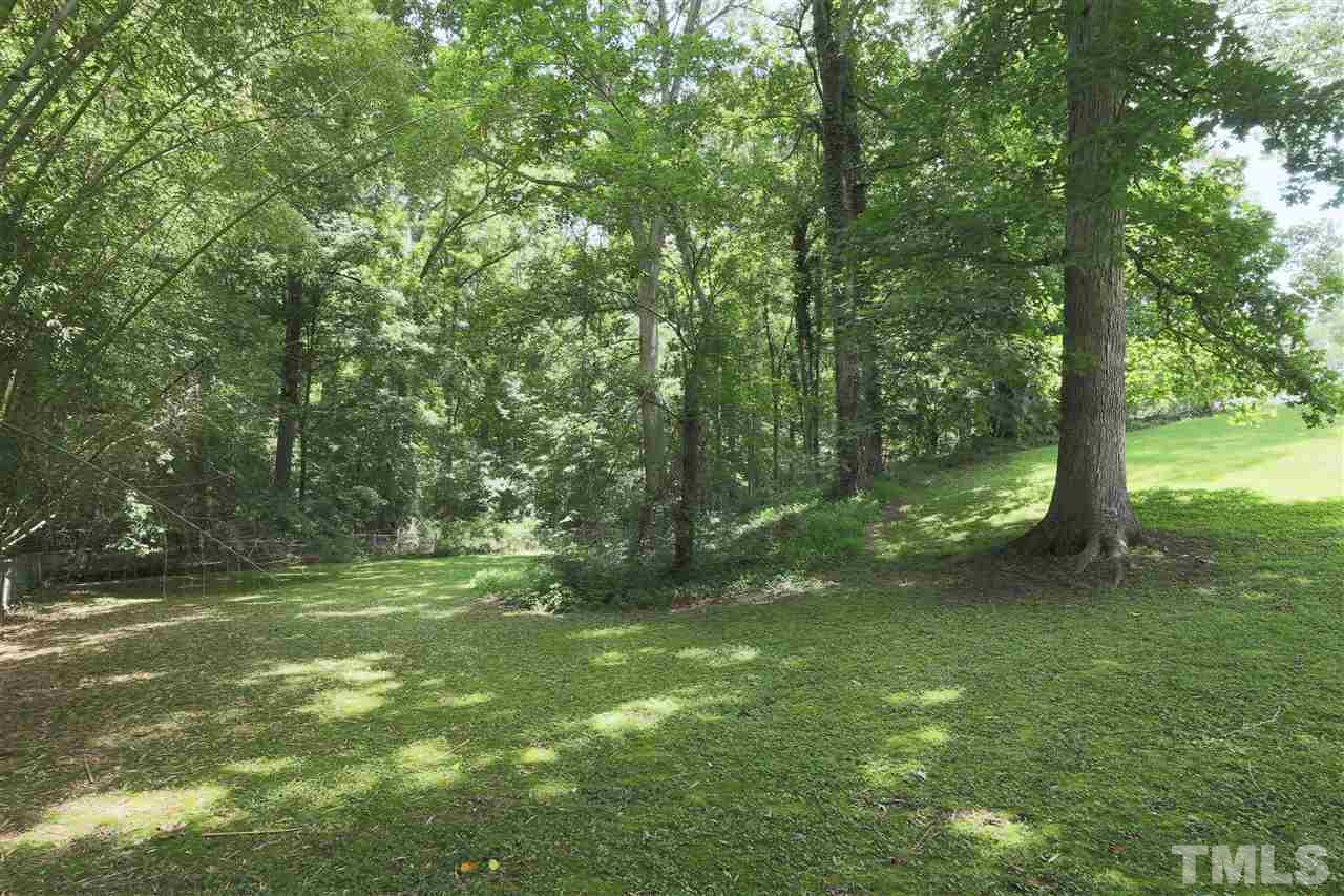 3501 Cranston Road Garner, NC 27529 - Photo 18 of 18 a view of a field with a tree