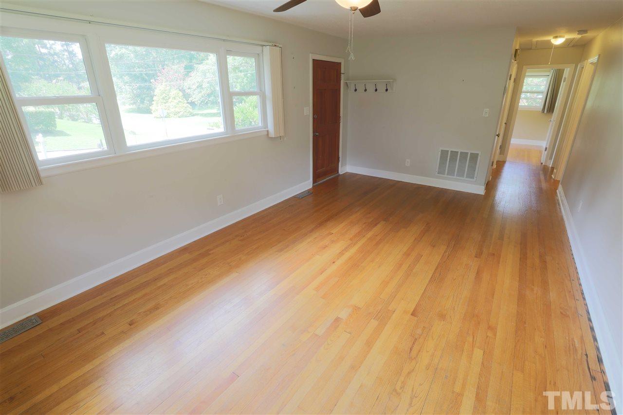 3501 Cranston Road Garner, NC 27529 - Photo 7 of 18 a view of empty room with wooden floor and fan