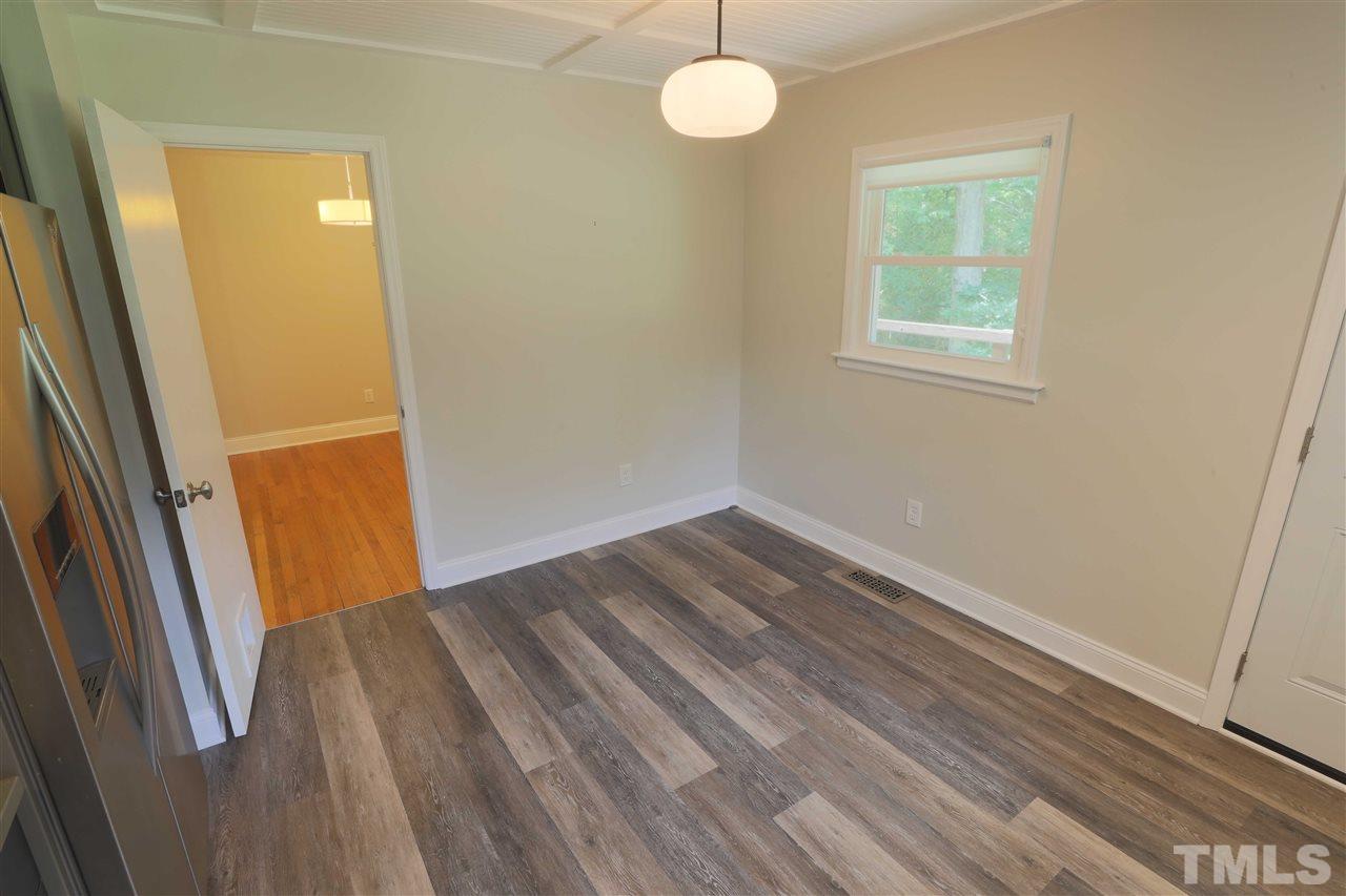 3501 Cranston Road Garner, NC 27529 - Photo 10 of 18 an empty room with wooden floor and windows