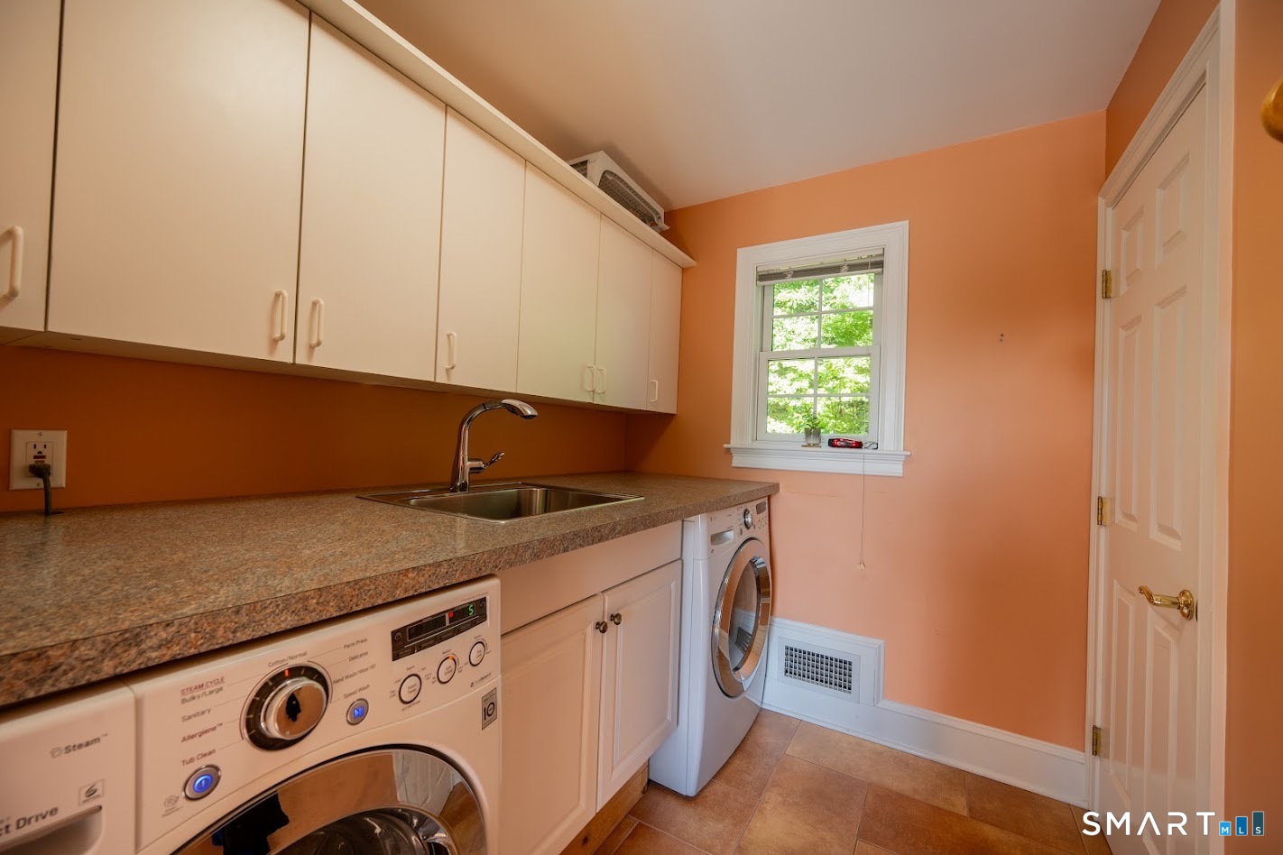 35 Anderson Lane Durham, CT 06422 - Photo 21 of 25 Spacious first floor laundry room with built-in cabinetry, utility sink, generous counter space, and abundant storage to simplify everyday living.