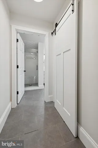 a view of a bathroom with a shower and a sink