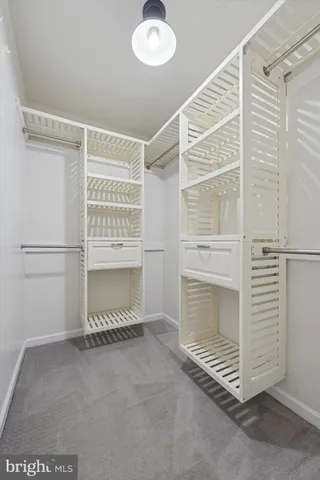 a view of an empty room with a fireplace