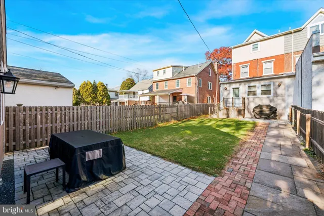a view of a patio with a table and chairs