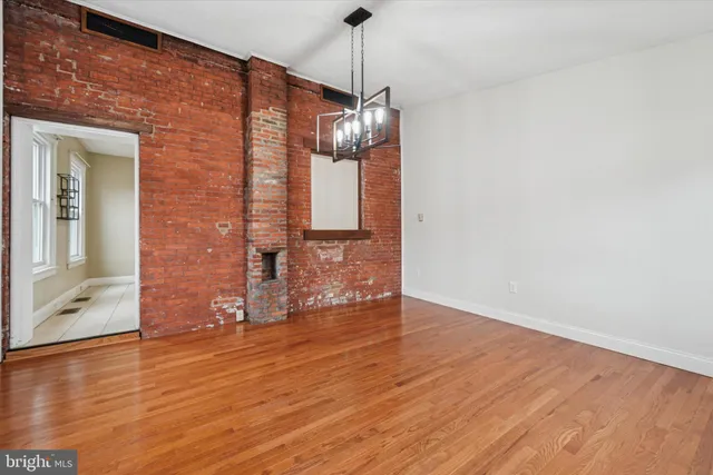 a view of a livingroom with wooden floor