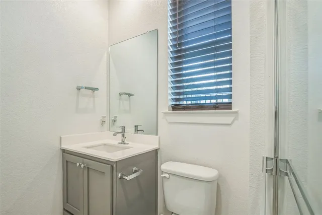 a bathroom with a double vanity sink mirror and double