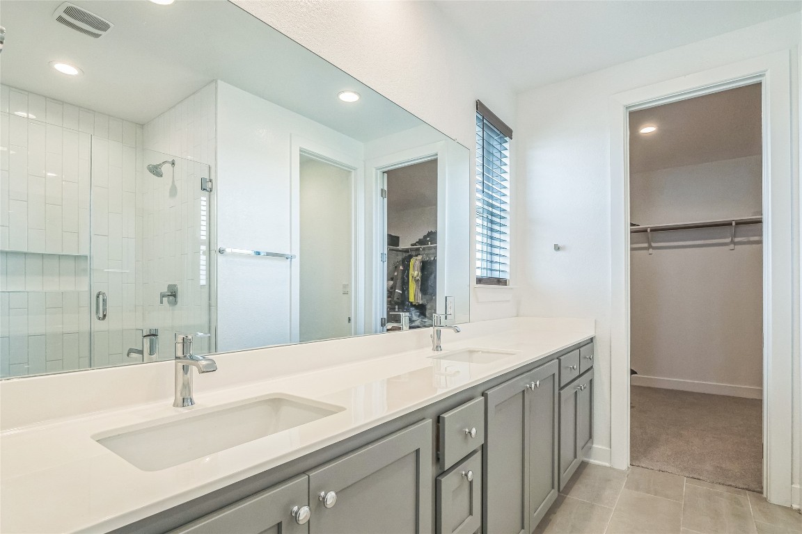 3706 Mesquite Vly Road Georgetown, TX 78628 - Photo 22 of 30 a bathroom with a double vanity sink mirror and double