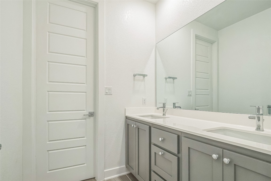 3706 Mesquite Vly Road Georgetown, TX 78628 - Photo 23 of 30 a bathroom with a sink and a mirror