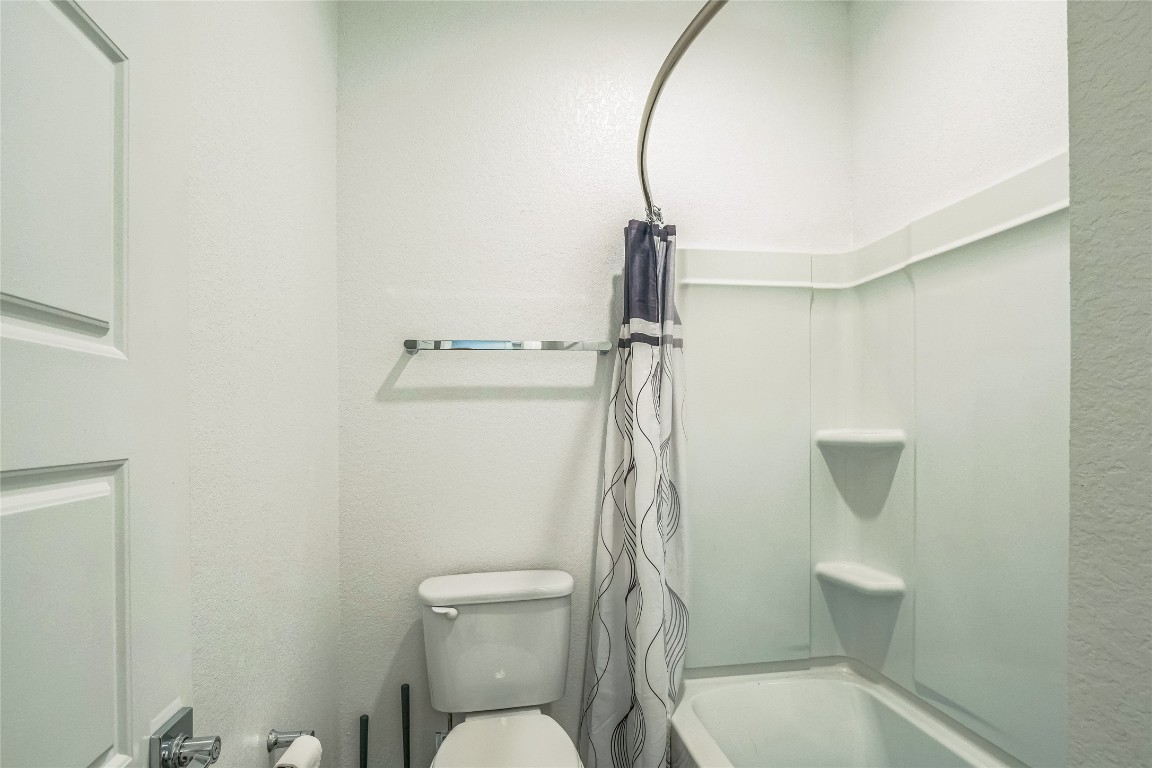3706 Mesquite Vly Road Georgetown, TX 78628 - Photo 24 of 30 a bathroom with a toilet and a shower