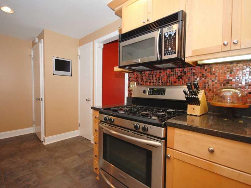 146 Orchard Spring Road Pittsburgh, PA 15220 - Photo 11 of 25 Kitchen. The built-in TV makes it a breeze to follow your favorite chef while preparing dinner. The door to the right of the TV opens to a custom-built pantry. Access the basement via the door on the left.