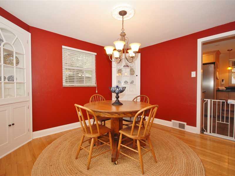 146 Orchard Spring Road Pittsburgh, PA 15220 - Photo 8 of 25 Dining Room. Opposite angle view of the dining room showing the two corner built-ins and decorative ceiling molding surrounding the chandelier. A glimpse of the kitchen is seen at the right.