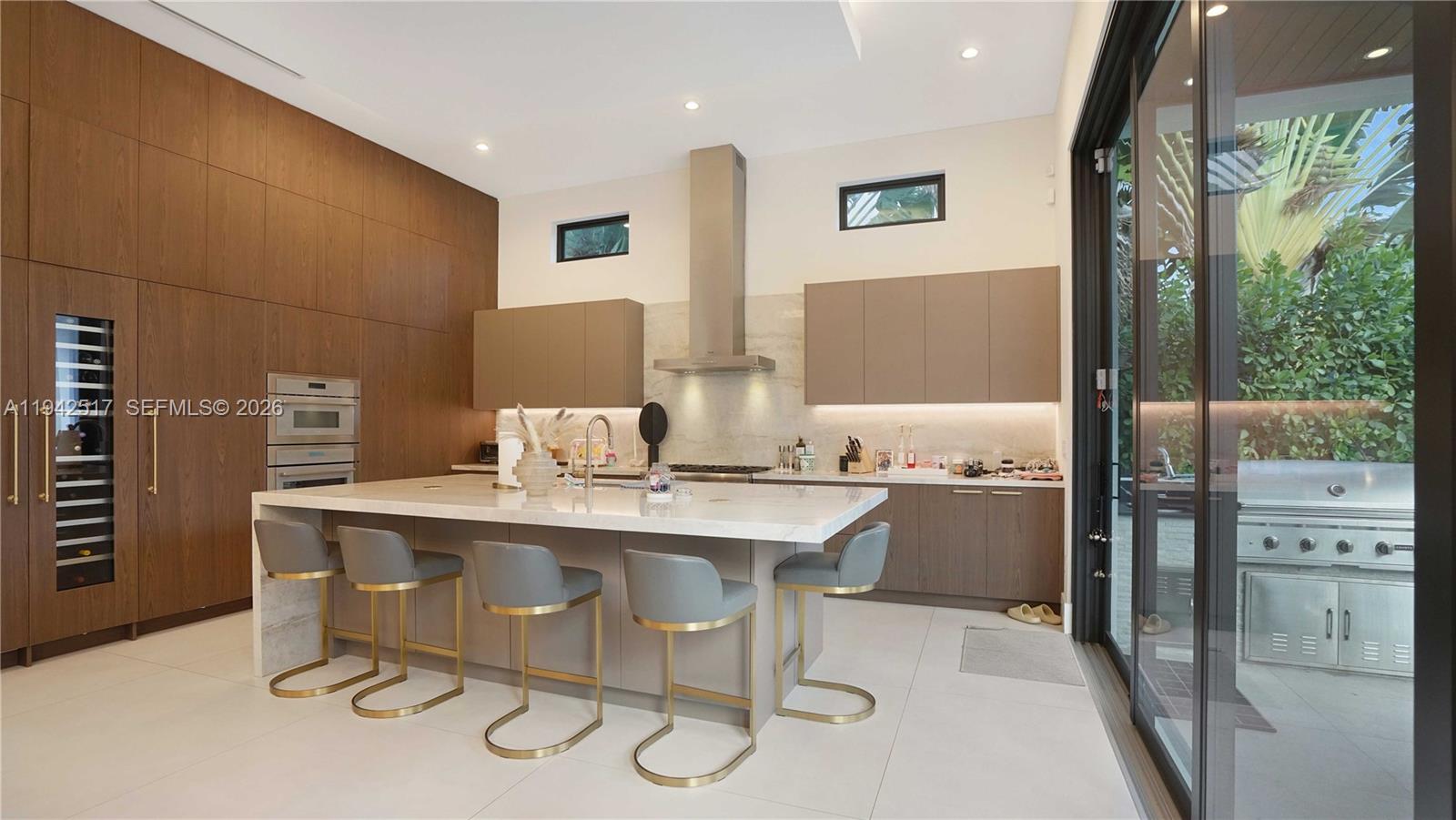 510 Northeast 4th Lane Boca Raton, FL 33432 - Photo 13 of 67 a kitchen with stainless steel appliances a sink and a refrigerator