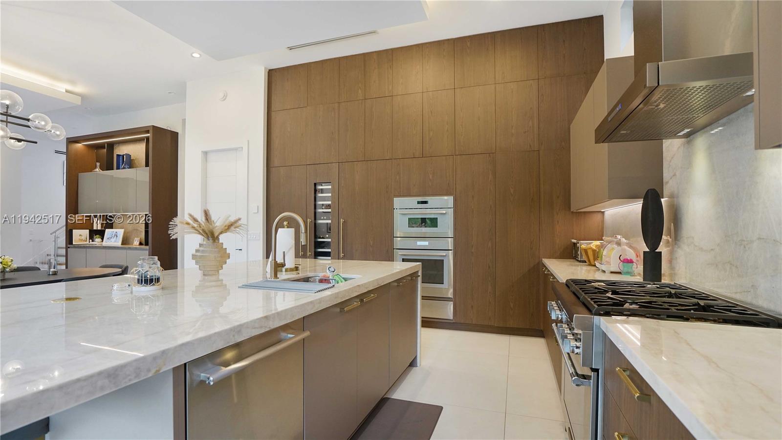510 Northeast 4th Lane Boca Raton, FL 33432 - Photo 16 of 67 a kitchen with stainless steel appliances a sink stove and cabinets