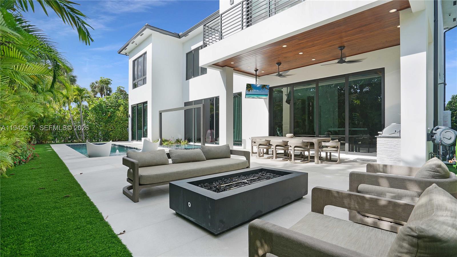 510 Northeast 4th Lane Boca Raton, FL 33432 - Photo 23 of 67 a view of a patio with couches table and chairs with garden view