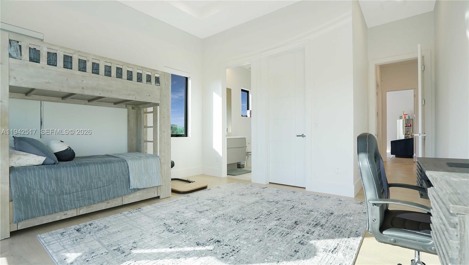 510 Northeast 4th Lane Boca Raton, FL 33432 - Photo 44 of 67 a bedroom with furniture and a wooden floor