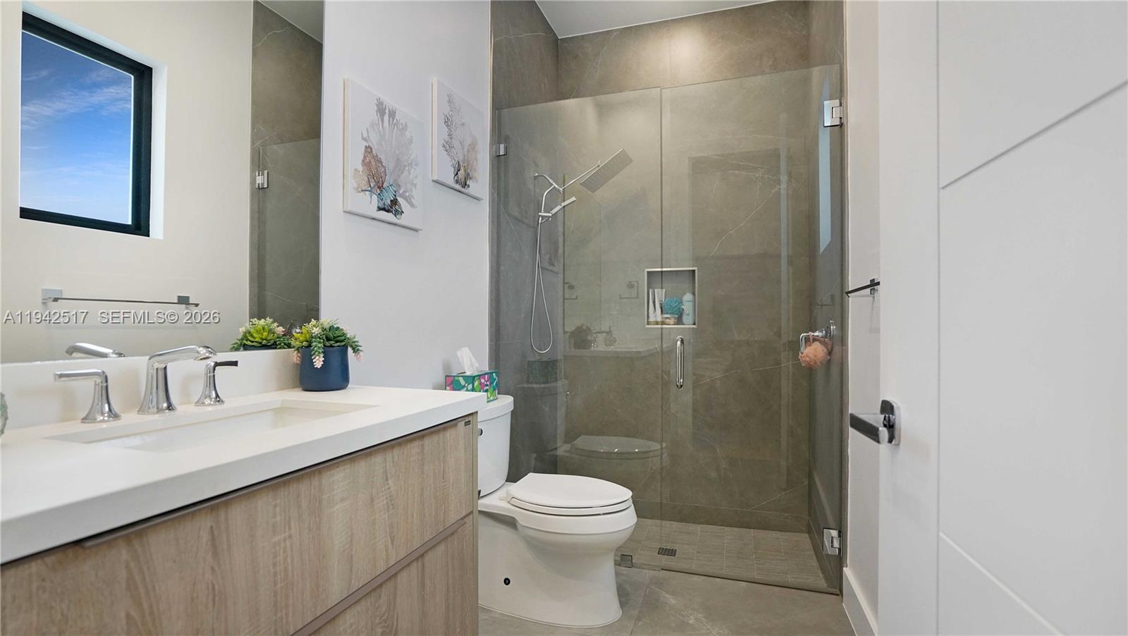 510 Northeast 4th Lane Boca Raton, FL 33432 - Photo 48 of 67 a bathroom with a sink a toilet and shower