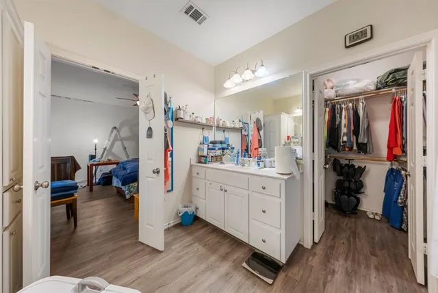 a view of living room with furniture and wooden floor