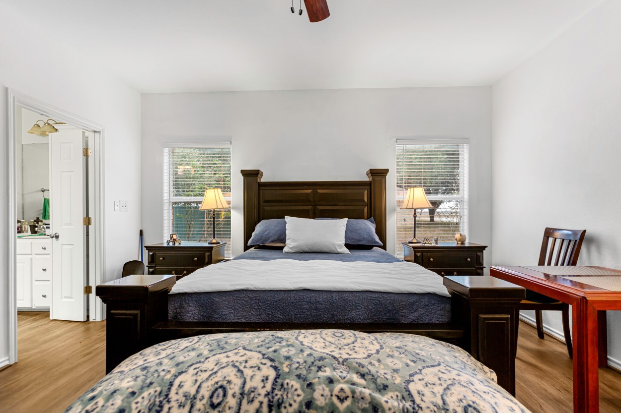 107 Frederick Lane Thorndale, TX 76577 - Photo 7 of 11 a bedroom with a bed and wooden floor