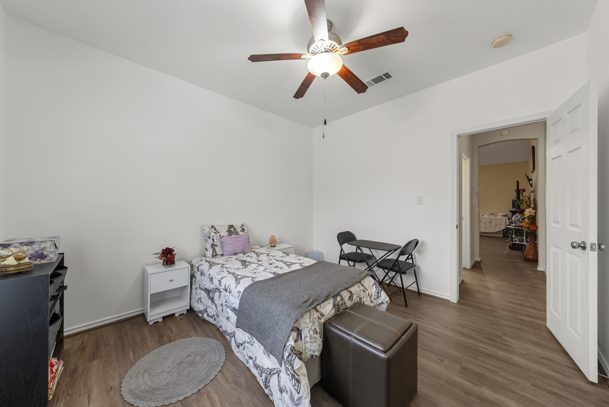 107 Frederick Lane Thorndale, TX 76577 - Photo 8 of 11 a bedroom with bed and a chandelier