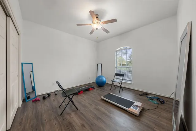 a work room with furniture and wooden floor