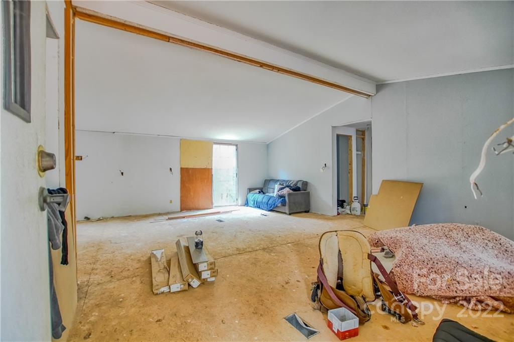 245 Dickson Road Blacksburg, SC 29702 - Photo 5 of 13 a bedroom with a bed and wooden floor