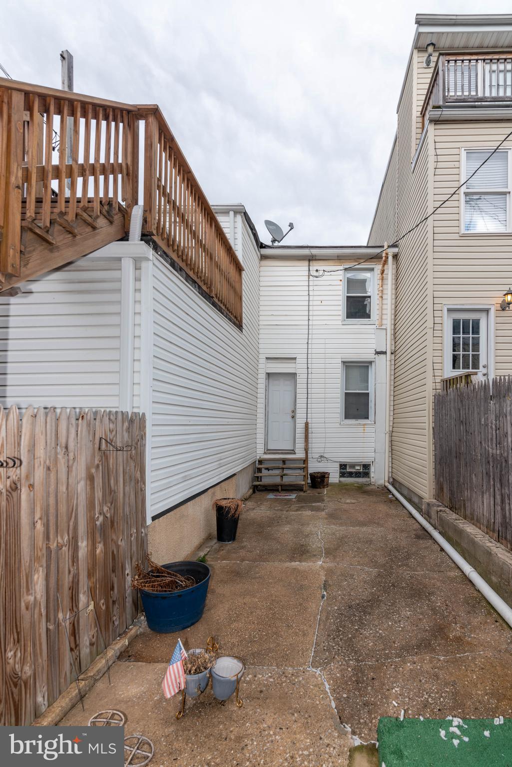 1622 Patapsco Street Baltimore, MD 21230 - Photo 28 of 30 a view of a house with a barbeque and wooden stairs